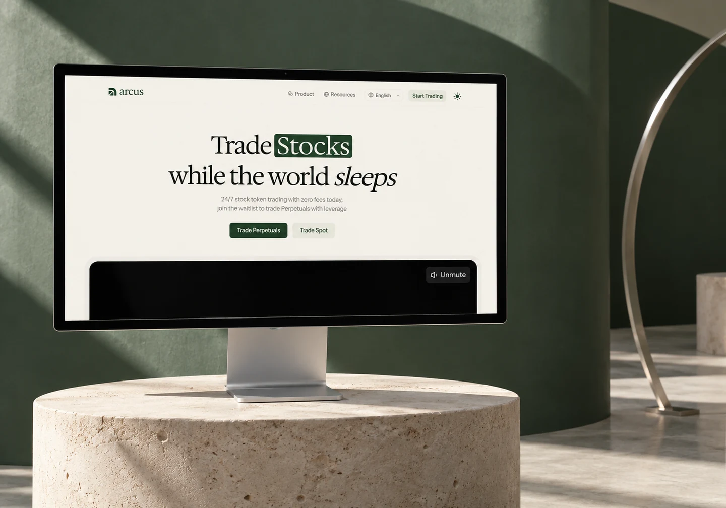 Arcus homepage on an Apple Studio Display with sculptural green walls and a limestone plinth.